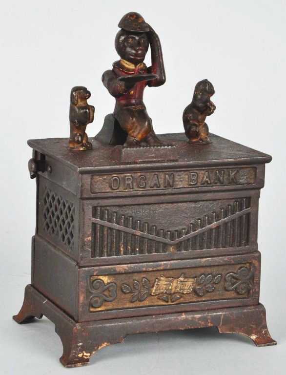 Cast Iron Organ Mechanical Bank.: Manufactured by Kyser & Rex. Dancing cat and dog variation. Working. Broken crank and missing trap. Size: 7 - 3/4" T. Condition: (Very Good).