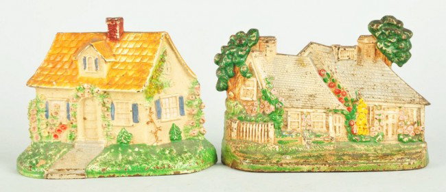 Lot of 2: Cast Iron Cottage Doorstops.: Made by Hubley. Size: Largest: 8" L. Condition: (Very Good).