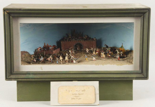 Early Wooden Metal Soldier Diorama.: Includes approximately 50 soldiers set up in battle scene. Size: Box: 24" x 12" x 12 - 1/2". Condition: (Very Good).