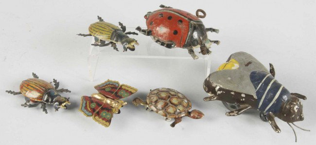 Lot of 6: Tin Litho Insect & Animal Toys.: German. Most marked "Made in Germany". Includes one wind-up lady bug, one wind-up fly, one butterfly, one turtle, and two beetle roller toys. Some paint chipping and litho loss. Size: Largest: 4" L. C