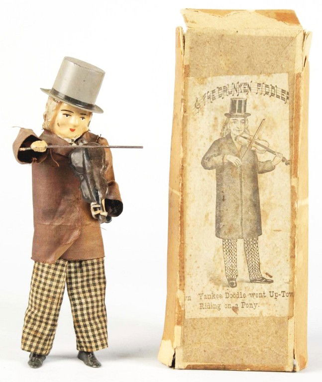 Tin Martin Drunken Fiddler Wind-Up Toy.: French. Working. Handpainted face, hands, and fiddle with wire body, lead feet, and original clothing. Left sleeve is faded, some slight paint loss to back of head, and paint chips to head and chin. I