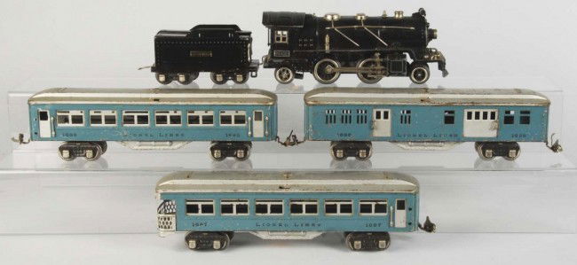 Rare Lionel O-Gauge No. 261 Passenger Train Set.: American. Includes no. 261-E steam engine, Lionel Lines tender, and no. 1685, no. 1686, and no. 1687 blue and silver passenger cars. Cars are missing five handrails and set has moderate scratching and