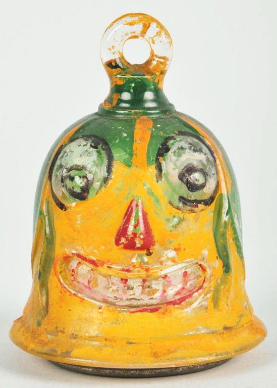 Glass Halloween Jack-O-Lantern Candy Container.: Original tin closure, bulging eyes, and recessed teeth. 80% paint remains. Size: 3 - 1/2" T. Condition: (Excellent).