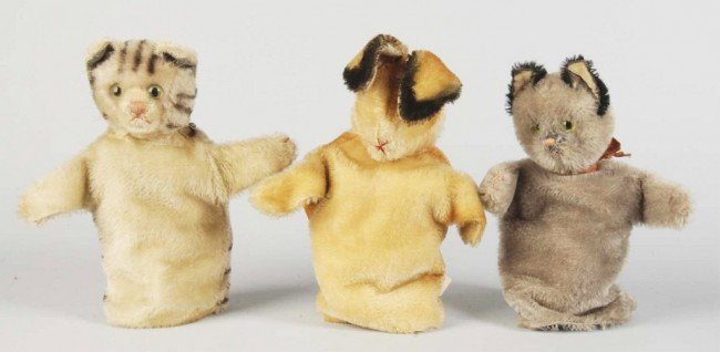Lot of 3: Steiff Animal Hand Puppets.: German. Includes two cats and one rabbit. All with glass eyes and whiskers. Size: Each: 8" T without ears. Condition: (Excellent).