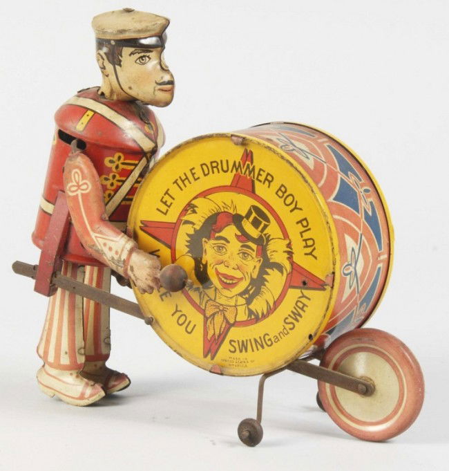 Tin Litho Marx George the Drummer Boy Wind-Up Toy: American. Working. Some litho loss on right arm and some overall scratching and wear. Size: 8 - 1/2" L. Condition: (Very Good).