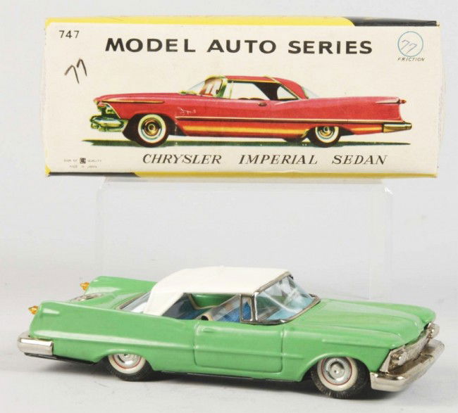 Tin Litho Chrysler Imperial Sedan Friction Toy.: Japanese. 1959. Working. Made by Bandai. Very little wear overall. Includes original box with tissue paper. Old store stock. Size: 8" L. Condition: (Excellent).