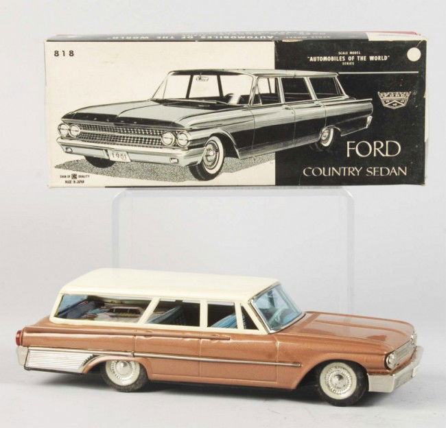 Tin Litho Ford Station Wagon Friction Toy.: Japanese. 1961. Working. Made by Bandai. Very little wear overall. Includes original box with original cardboard inserts. Box has some slight staining. Old store stock. Size: 10 - 1/2" L. Condition: (
