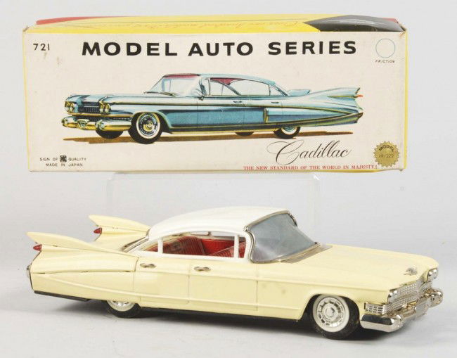 Tin Litho Cadillac Sedan Friction Toy.: Japanese. 1959. Working. Made by Bandai. Rear windshield detached but present. Includes original box with cardboard insert and tissue paper. Box with some creasing. Old store stock. Size: 11" L. Condi