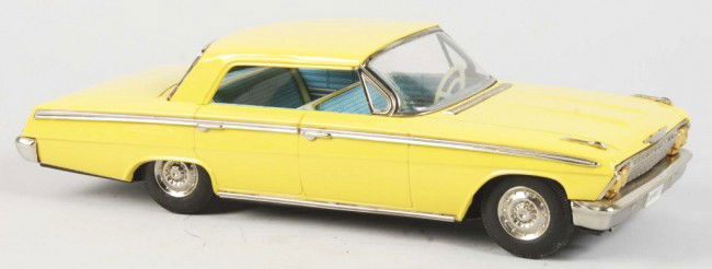 Tin Litho ATC Chevrolet Car Friction Toy.: Japanese. Working. Unusual yellow color. Original price sticker on bottom marked "1963". Some oxidation to bare metal on back windshield. Old store stock. Size: 11 - 1/2" L. Condition: (Excellent).