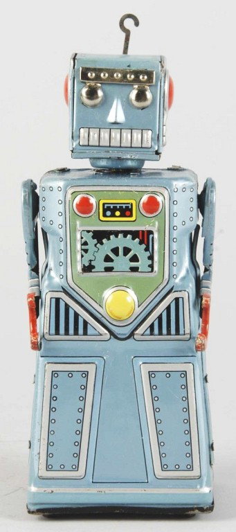 Tin Litho Hook Friction Toy Robot.: Japanese. Working. Made by Wacko. Fairly scarce robot. Marked "Made in Japan" on rear. Original hook. When in operation, head turns back and forth. Lithographed dial and gears on chest and back. Some 