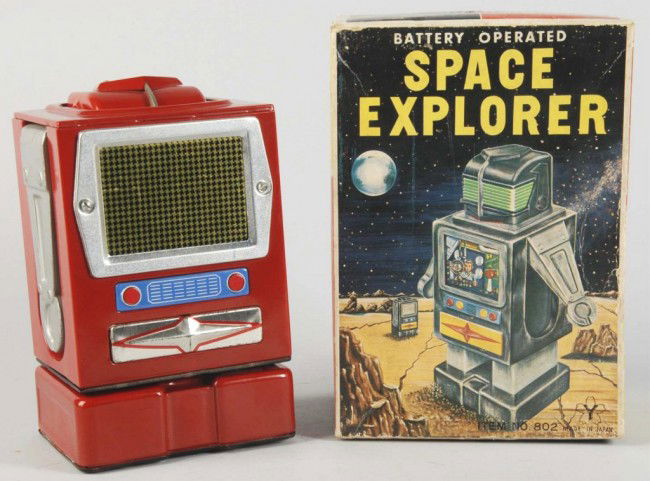 Tin Litho Space Explorer Battery-Operated Toy.: Japanese. Working. Made by Yonezawa. Red litho variation. When in operation, toy transforms from a television into a robot. Slight oxidation to chrome on front; otherwise, very little overall wear. In