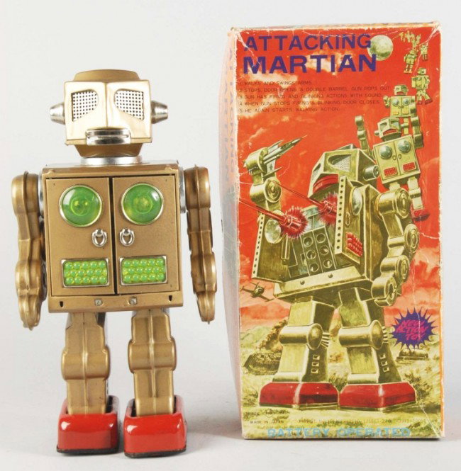 Tin Litho Attacking Martian Robot Battery-Op Toy.: Japanese. Working. Made by SH. Gold litho variation. When in operation, robot walks, swings arms, opens doors, and fires illuminated guns with gun-sounding noise. Battery box is clean. Some minor scra