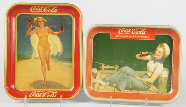 1937 & 1940 Coca-Cola Serving Trays.: 1937 tray with light surface scratches and medium border and rim wear and the 1940 tray has some spots, stains, slight fading, and medium wear. Size: Each: 13 - 1/4" x 10 - 1/2". Condition: (Very Good