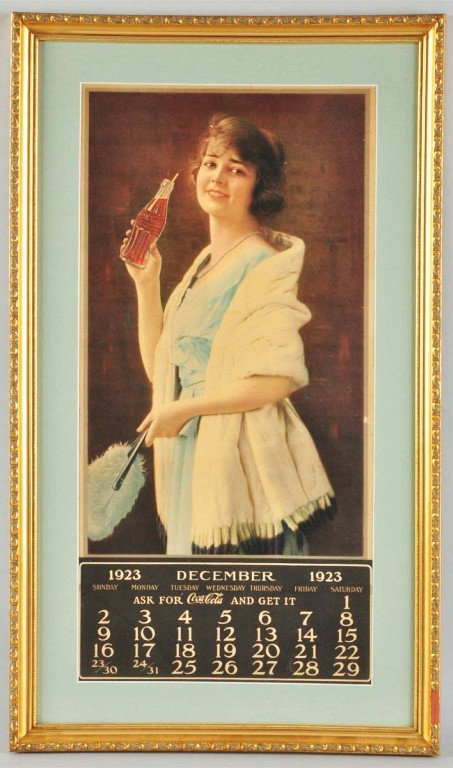 1923 Coca-Cola Calendar.: Matted and framed under glass. Includes December page only. Missing metal strip. A few dark spots, medium soiling, and light wear. Size: Framed: 28 - 3/4" x 16 - 3/4". Condition: (Excellent).