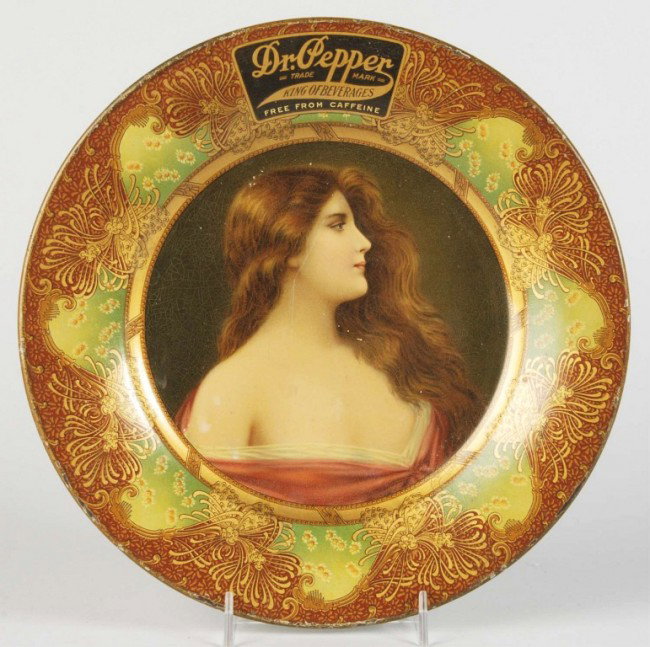 Dr. Pepper Vienna Art Plate.: Circa 1908. Features girl facing to her left. Beautiful tray and border with just general overall light wear, minor marks, and uniform crazing. Size: 10" Dia. Condition: (Excellent Plus).