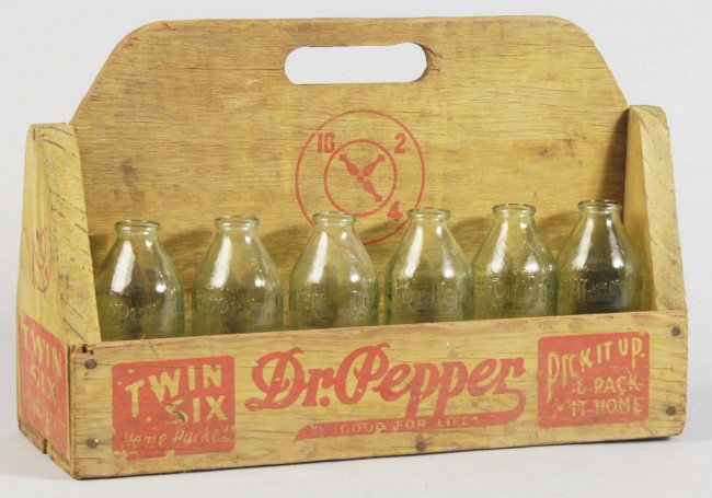 Wooden Dr. Pepper 12-Pack Carrier.: 1930s to 1940s. Hard-to-find item. Strong stencil on all four sides. Comes with 12 six-ounce Dr. Pepper no return bottles from a later period. A few very minor surface split to center wood panel; othe