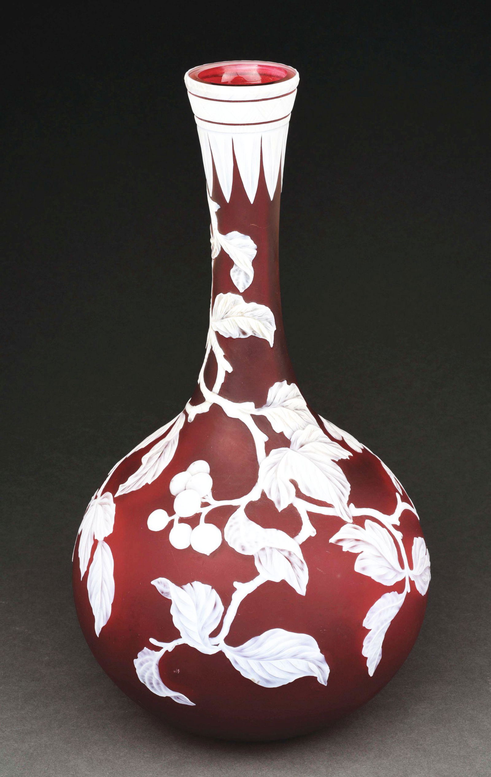 MOMUMENTAL WEBB CAMEO VASE.: Large cameo vase attributed to Thomas Webb and Sons. White berries and branches on red. Free of any chips or cracks with some minor surface scuffs from use. Condition: (Excellent). Dimensions: 14" x 7