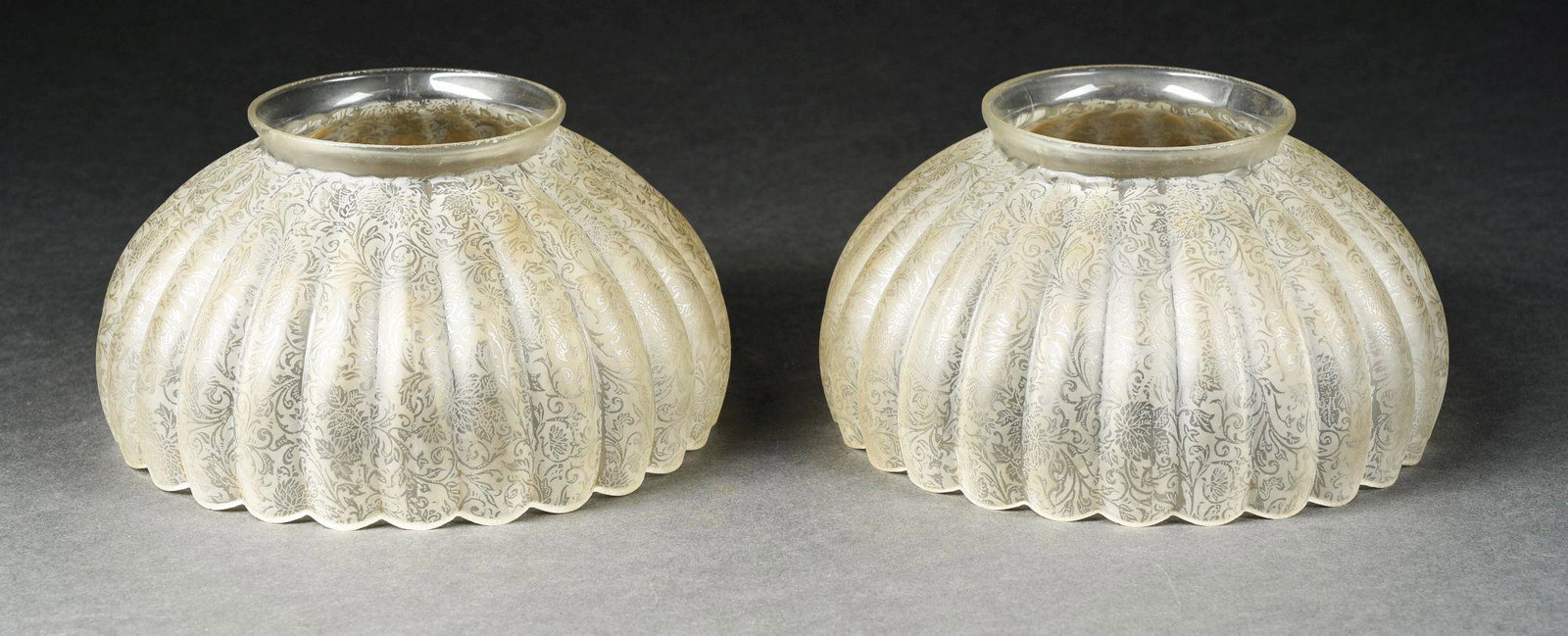 LOT OF 2: ETCHED AND FLUTED VICTORIAN SHADES.: Both shades have a diameter of 7 - 1/2". Both are in excellent condition, free of any cracks or chips to the bodies or lower rims. One of the shades has chipping to the fitter edge. There is some brow
