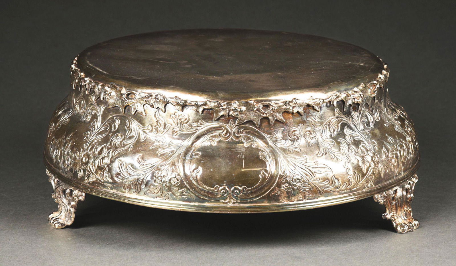 A SILVER PLATED CENTERPIECE BASE. (1 of 4)