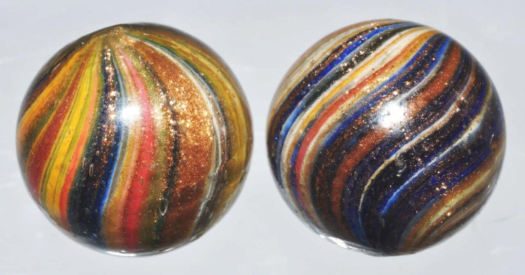 Lot of 2: Onionskin Lutz Marbles.: Both marbles have great color and are loaded with Lutz. Several as-made indentations to surface of glass. Both: 3/4" Dia. Condition: (9.1).