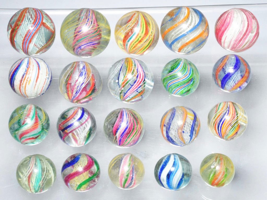 Lot of 20: Assorted Handmade Marbles.: Includes nine divided core swirls, three solid core swirls, six latticino swirls, one Joseph's Coat, and one onionskin. Range: 7/8" to 1 - 3/8" Dia. Condition: (8.5).