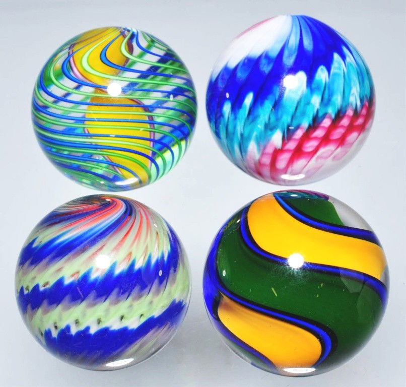 Lot of 4: Contemporary Marbles.: Includes one Fritz Lauenstein (not signed or dated) with ribbon swirls of dark green, blue, and orange, one Charles Gibson multi-colored snakeskin (not sighed or dated, circa 1998?) in blue, green, an