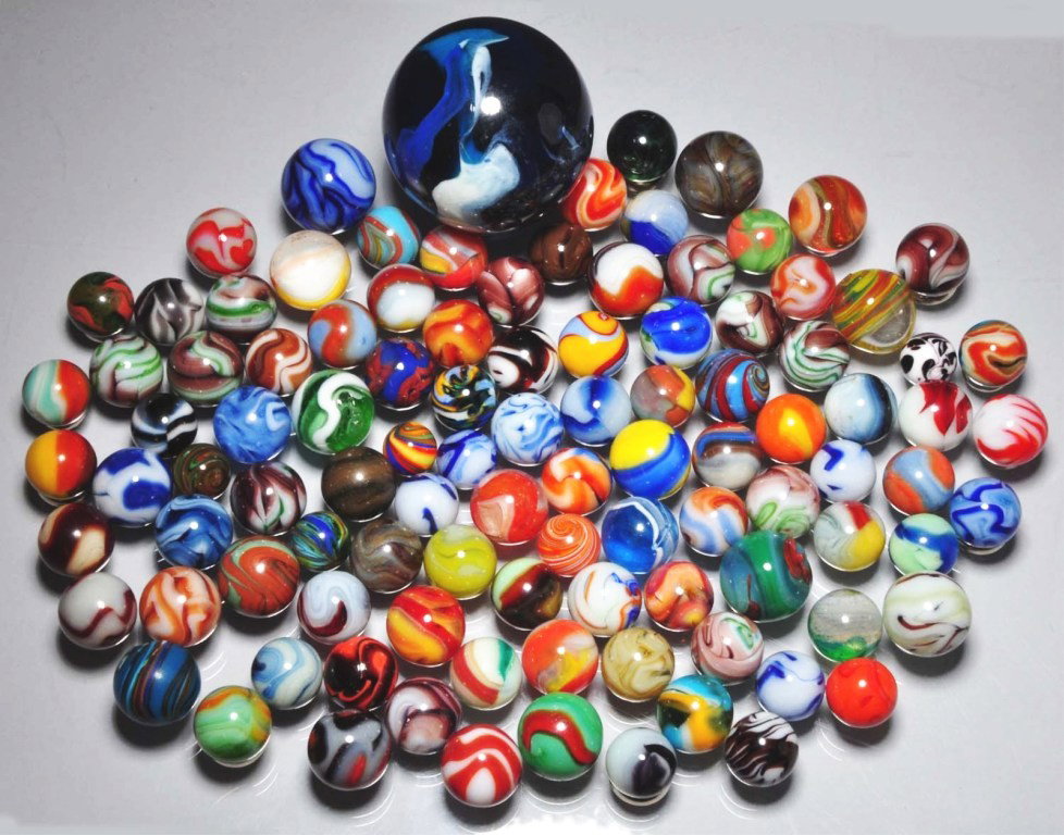 Lot of Approximately 105 Marbles.: Includes machine-mades from Alley Agate, Akro Agate, Marble King, Alox Agate, and contemporary torched marbles of various colors. Range: 1 - 1/2" to 1 - 7/8" Dia. Condition: (9.0).