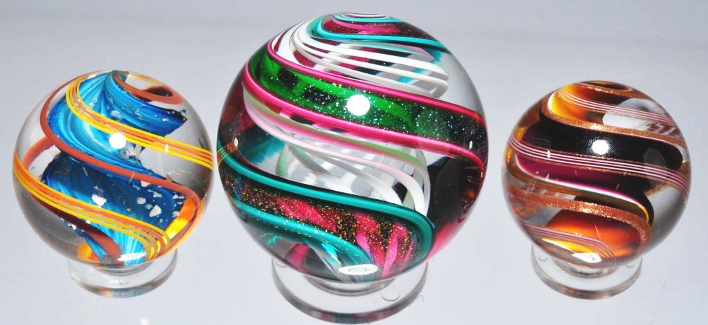 Lot of 3: Seese & Murray Marbles.: Includes one Eddie Seese Lutz swirl with reddish dichroic circa 2004, one William Murray in maroon and red with lutz bands signed WM '04, and one William Murray blue twist with mica and yellow with ou