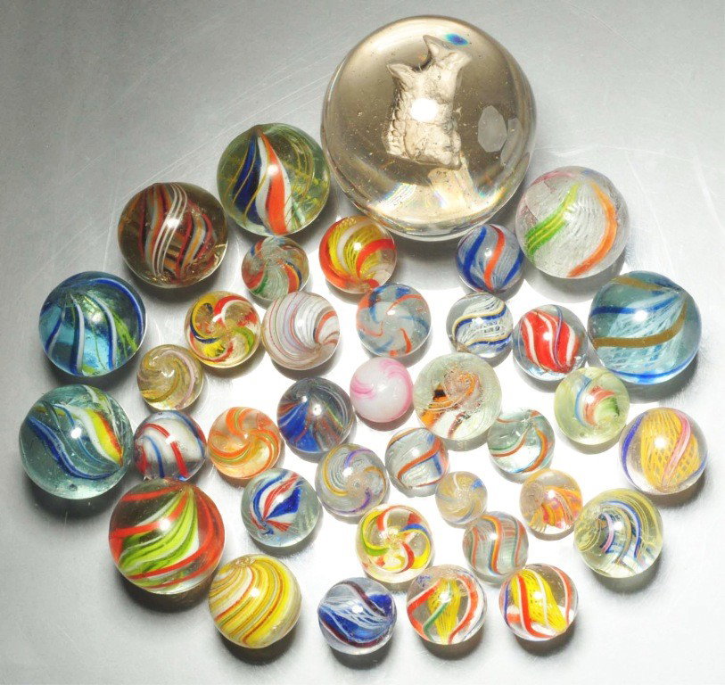 Lot of 37: Assorted Handmade Marbles.: Includes one large sulphide squirrel that has been polished (no chips showing) while the remaining marbles all have their original surfaces. Group also includes solid core swirls, divided core swirls,