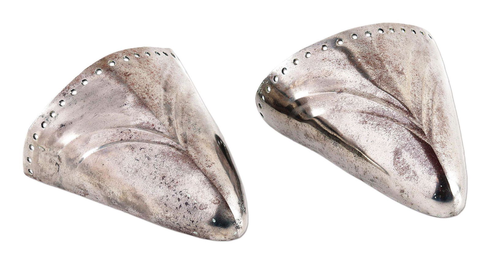 LOT OF 2: PAIR OF ARMOR TOES WITH REPOUSSE DESIGN.: Lot consists of a pair of armor toes measuring approximately 3 - 3/4" x 4 - 1/2" x 2". Raised medial ridge with a repousse geometric design, symmetrical about the ridge, appropriate to Maximilian armo