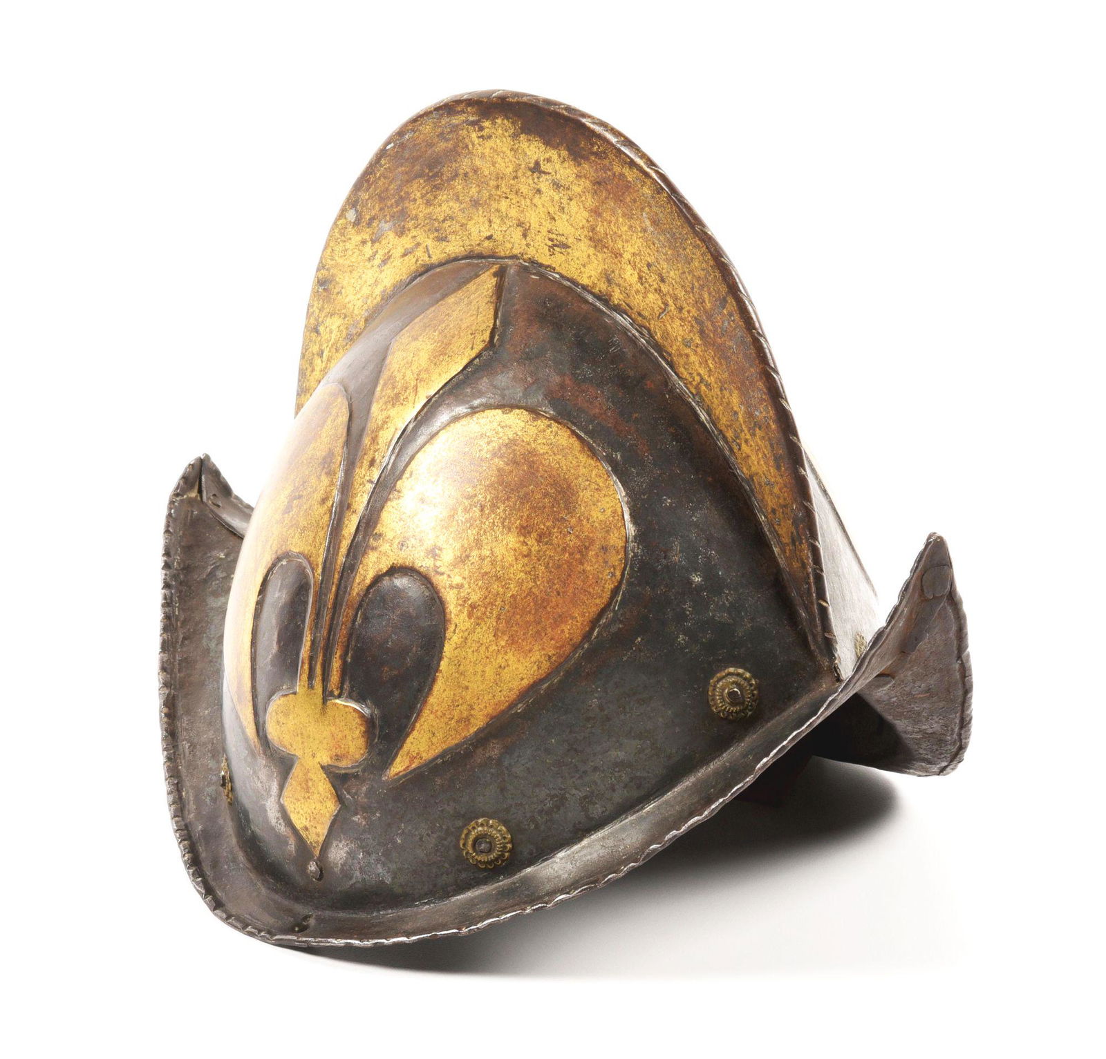 A GERMAN MORION WITH GILT AND BLUED DECORATION OF THE MUNICH ROYAL GUARD.: Circa first quarter of the 17th century. Distinct form with a high comb and dual peaks. 2 piece construction with 8 floral rosettes. Top of comb is rolled over, with 2 pins fastening the pieces togeth