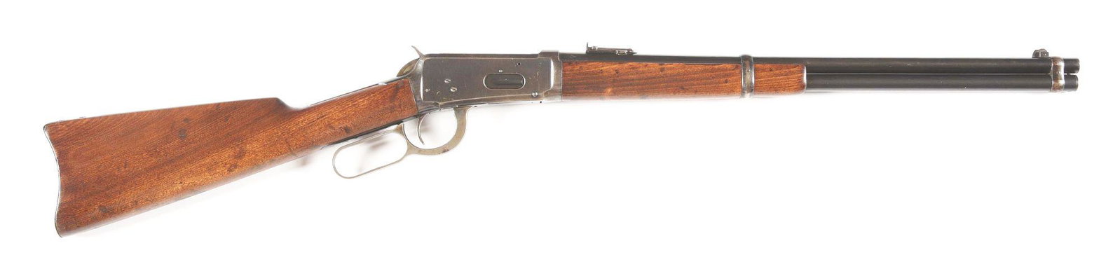 (C) WINCHESTER MODEL 94 LEVER ACTION CARBINE IN DESIRABLE 25-35 W.C.F.: Winchester Model 94 Saddle Ring Carbine in desirable 25-35 W.C.F. made in 1909. 20" round nickel steel barrel with pinned blade front sight and carbine style rear sight with blued full magazine. Blued