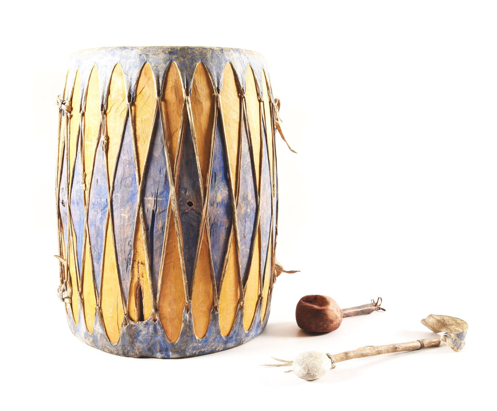 LOT OF 2: NATIVE AMERICAN DRUM AND RATTLE.: Lot consists of (A) Large painted Plains Indian drum circa 1940s. Stretched, native tanned rawhide heads on both ends and painted blue overall. Includes wood handled, leather covered drum beater with 