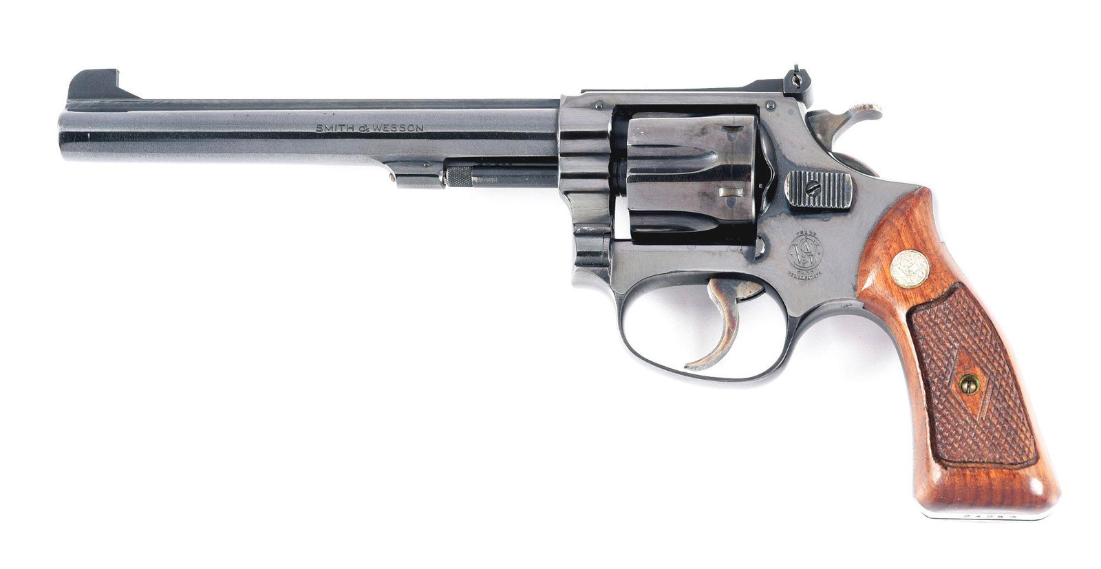 (C) SMITH & WESSON MODEL 1953 TARGET DOUBLE ACTION REVOLVER.: Made 1955. Standard markings on both sides of the barrel. Small trade mark on the left side of the frame. Company address on the right side of the frame. Matching serials on the barrel, cylinder, and