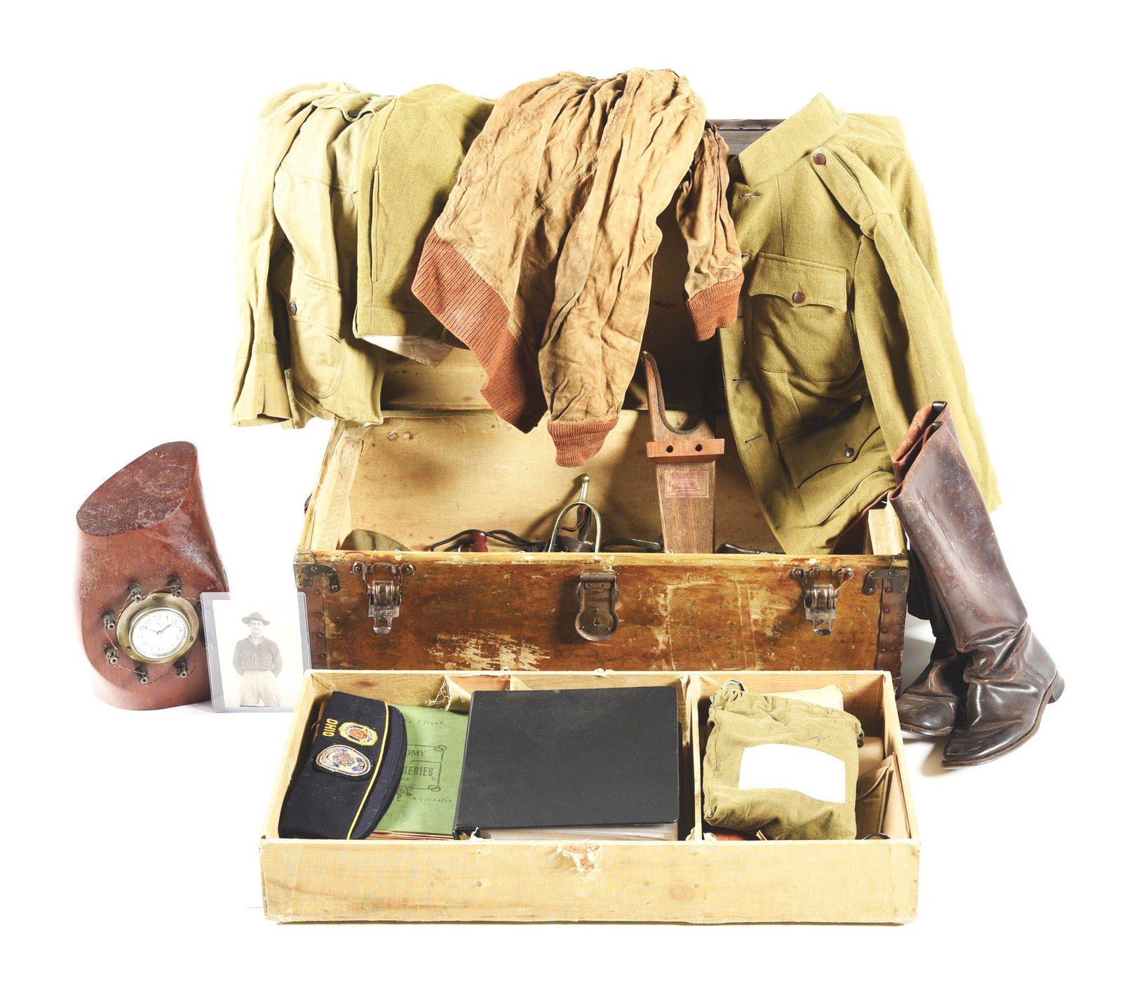 US WWI ARMY AIR SERVICE TIME CAPSULE PAINTED FOOTLOCKER, UNIFORM, PHOTO, AND DOCUMENT GROUPING.: Exceptional example of a US World War I footlocker time capsule grouping named to 2nd Lieutenant Alfred George Schafer. The grouping is vast, and contains a plethora of paperwork, documents, photos, a