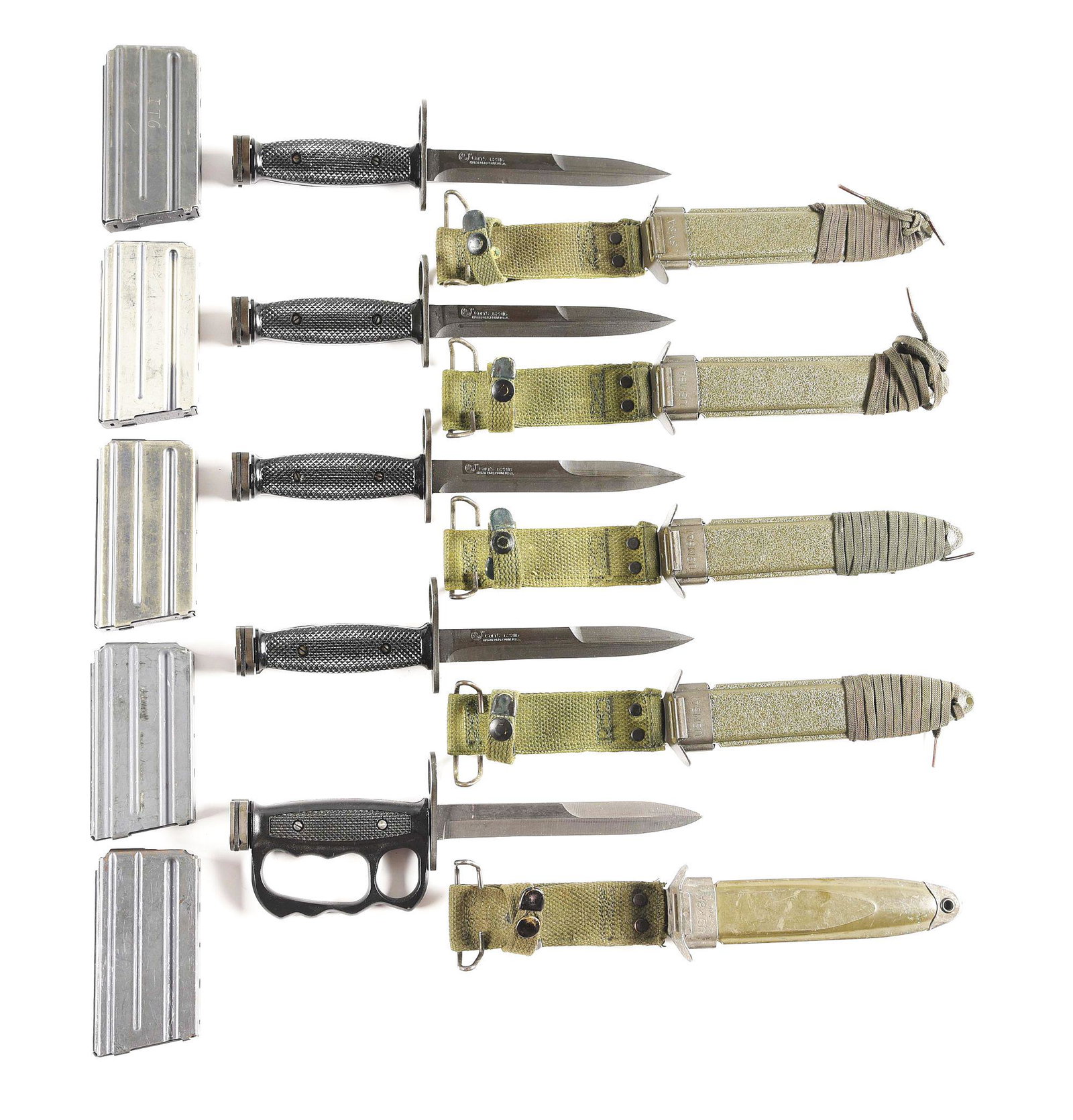 LOT OF COLT SP1 AND M16 BAYONETS AND MAGAZINES.: Lot consists of (A) 5 knives comprising 1 experimental Vietnam War era Conetta M7 bayonet with knuckle guard and M8A1 scabbard. CONDITION: Very good with evidence of wear and use throughout. 4 Colt ma