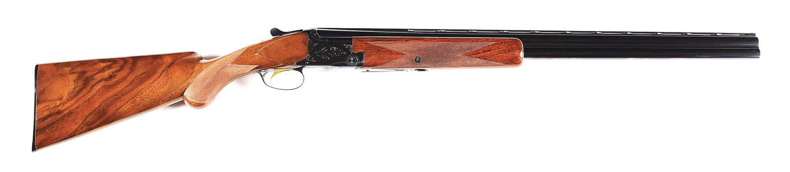 (M) BROWNING SUPERPOSED 12 GA OVER/UNDER SHOTGUN WITH BOX: Browning Superposed over under double barrel shotgun with box. Grade I gun made 1969 in Belgium. Standard markings on the barrel. Matching serials throughout. Round, steel barrels with a full vent rib