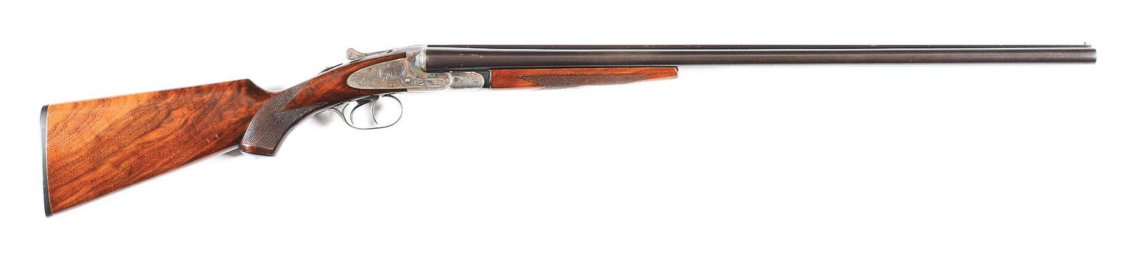 (C) LC SMITH IDEAL GRADE SIDE BY SIDE SHOTGUN.: Made by the L.C. Smith Gun Company of Fulton, New York in 1946. 28" blued 16 gauge London Steel barrels with 2 - 3/4" chambers, extractors, high sight plane, and Full and Improved Modified chokes. Cas