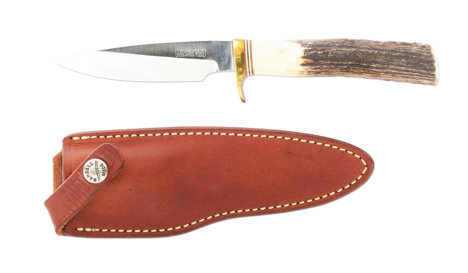 RANDALL MODEL 26 PATHFINDER WITH LEATHER SCABBARD AND CASE.: Randall Model 26 Pathfinder. The knife features a 4" drop point satin finished blade, brass guard, and stag grip. Red, white, and black spacers separate the guard and the grip. The knife is complete w