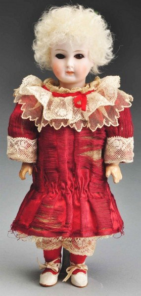 Very Rare Doll with Ball Jointed Neck.: Early pale German bisque socket head with solid dome incised "2". Very rare and unusual flange neck with a wooden ball joint in the neck socket, hand cut (uneven at corners) almond-shaped eyes with bl