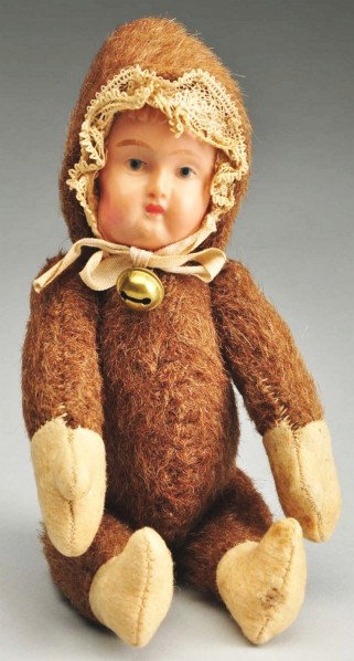 Germany Bear with Celluloid Face.: Mohair plush body with jointed shoulders and hips, felt hands and feet, celluloid mask face with painted features. Size: 8" T. Condition: (Excellent).