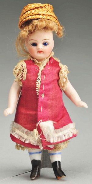 French All Bisque "Mignonnette" with Black Boots.: Bisque socket head incised "1". Sweet round face with long tapered eyebrows, painted upper and lower eyelashes, blue inset glass eyes, closed mouth, and original mohair wig (scrappy). Swivel neck, peg