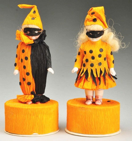 Lot of 2: Halloween Doll Candy Containers.: Each has a German all-bisque doll mounted on the candy box. Dolls have painted facial features, blonde mohair wigs, jointed shoulders and hips with pink molded boots, probably made by Hertwig. They ar
