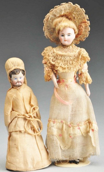Lot of 2: German Bisque Doll House Dolls.: Man with molded brown hair and painted mustache and beard, cloth body with bisque lower limbs, original outfit (religious cleric?). Lady with painted features, original blonde mohair wig, cloth body, 