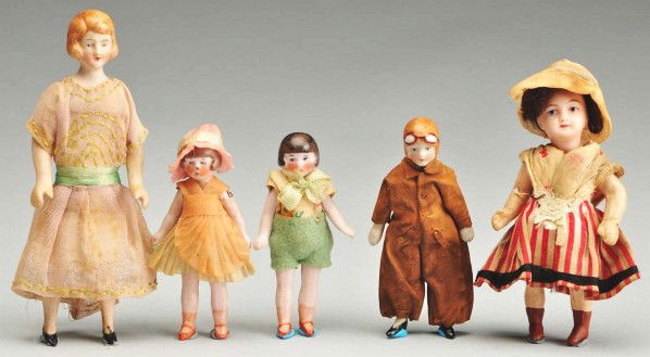 Lot of 5: Small Dolls.: Unis France girl with bisque head, painted features, mohair wig, five-piece composition body with painted boots, original regional costume. All bisque "Amelia Earhart Aviatrix" doll, molded hair and g