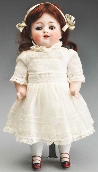 All Bisque Kestner Character Doll.: Incised "150 11" on head and "Germany" on body. Sweet smiling face with open mouth and upper teeth, dimples, multi-stroked eyebrows, painted upper and lower eyelashes, brown sleeping eyes, original br