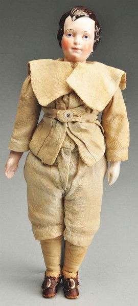 Desirable German KPM China Young Man Doll.: China shoulder head with pink flesh tint, molded dark brown hair (some paint wear on front and back) with side part and waves, molded eye sockets with blue painted eyes, red eyelid line, dark eyebrows