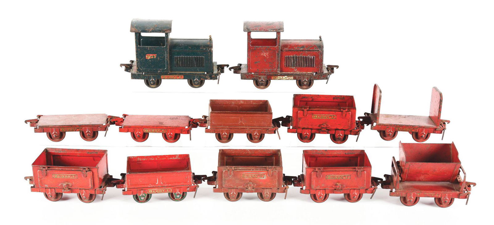 BUDDY L INDUSTRIAL RAILROAD.: C. 1920's. Includes two engines and ten working cars, all of which can use a good cleaning, but totally original. Condition: (Good). Dimensions: Largest: 8" x 5" x 5".