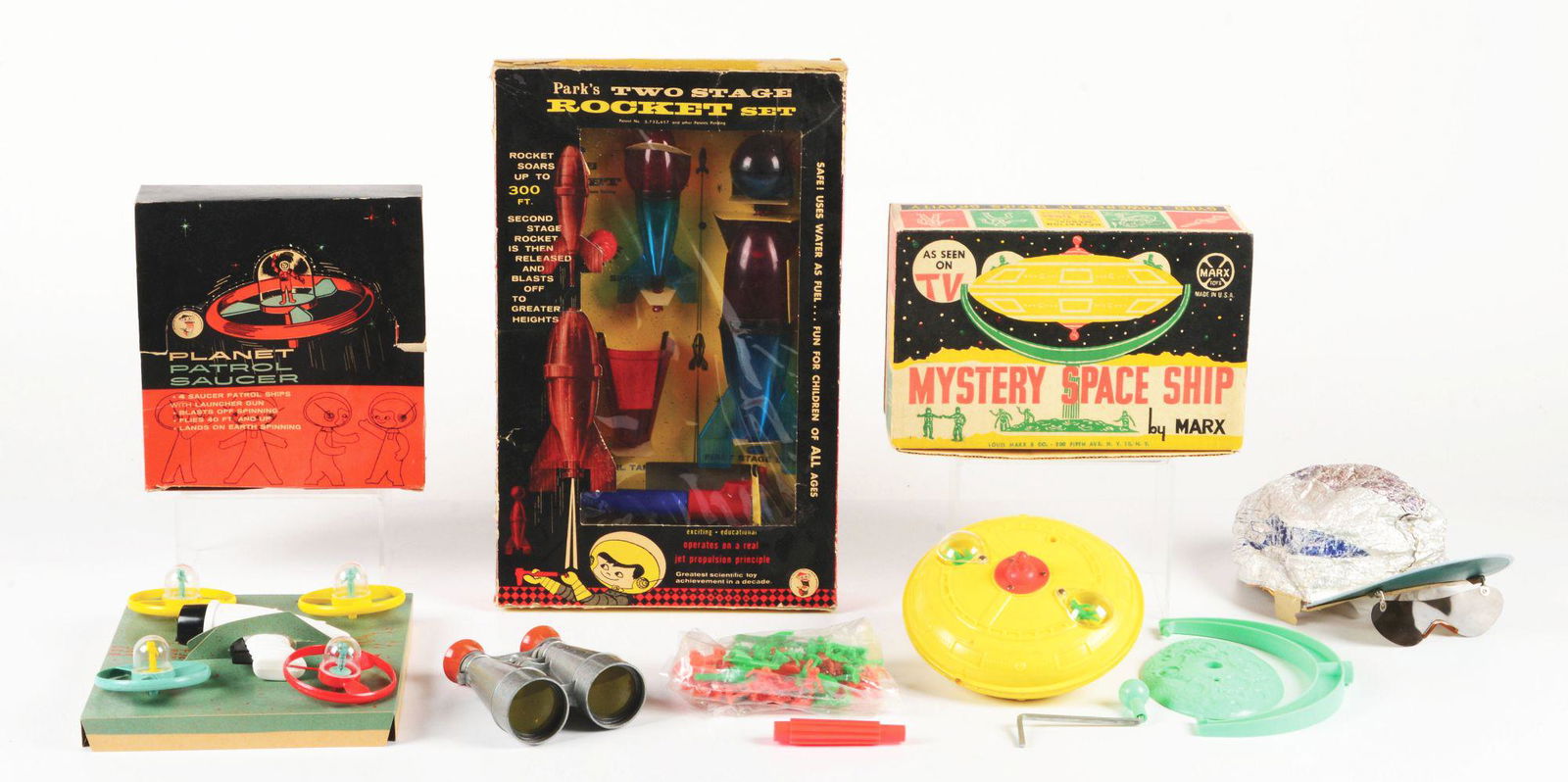 LOT OF 5: VARIOUS 1950'S AND 1960'S TOY SPACE-RELATED ITEMS.: Three in original boxes, including: a Marx Mystery Space Ship, nice and crisp, unused with instruction sheet and parts sealed on side; a Park's Two-Stage Rocket Set in original box, unused with insert