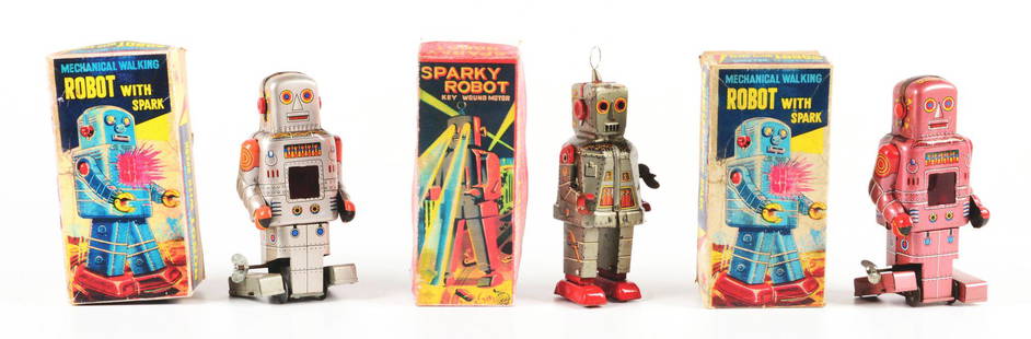 LOT OF 3: JAPANESE TIN LITHO WIND-UP ROBOT TOYS.: All in boxes. One is a mechanical walking spark robot in an unusual pink lavender color. There is another mechanical walking spark robot in silver with reproduction box. The third is a lithographed Sp